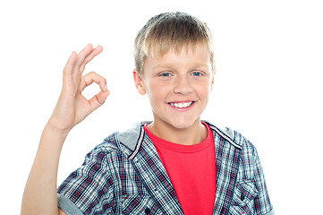 Image showing Enthusiastic young student flashing a perfect sign