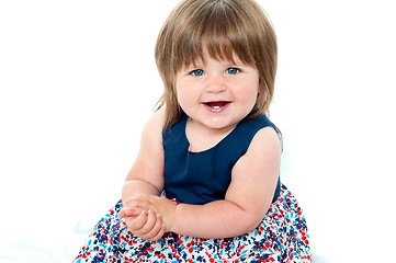 Image showing Portrait of an adorable baby girl sitting up