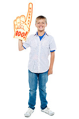 Image showing Young boy wearing a large foam hand