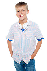 Image showing Fashionable kid posing with headphones around his neck