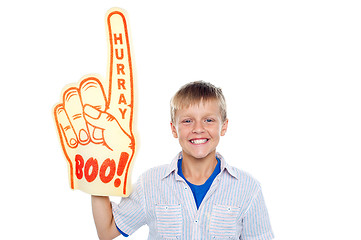 Image showing Boy with a hurray boo foam hand. Young fan