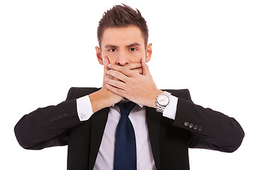 Image showing business man making the speak no evil gesture