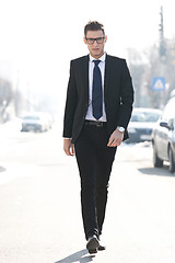 Image showing business man walking towards the camera