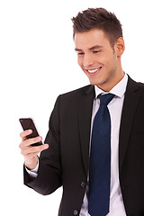 Image showing business man reading an SMS