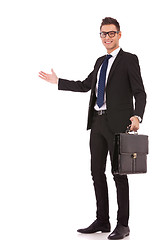 Image showing business man with a briefcase welcoming