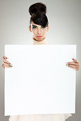 Image showing fashion woman presenting blank board