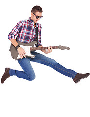 Image showing guitarist playing an electric guitar while jumping