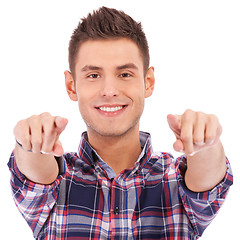 Image showing young casual man pointing