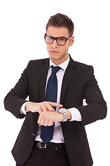 Image showing business man showing you that you are late