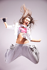 Image showing  cool woman dancer jumping in mid air