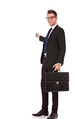 Image showing business man with briefcase presenting