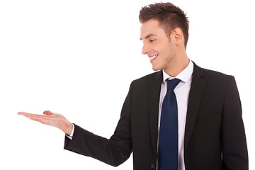 Image showing business man holding empty hand