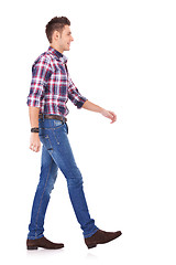 Image showing side of a walking young man