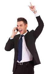 Image showing winning business man on the phone