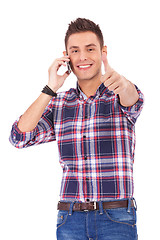 Image showing Man With Thumbs Up on the phone