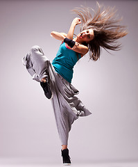 Image showing headbanging woman dancer screaming