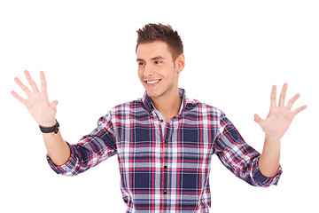 Image showing man pushing with his palms an imaginary keyboard