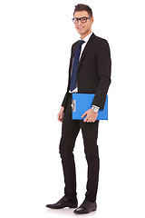 Image showing young business man with a blue clipboard