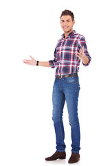 Image showing casual man gesturing welcome
