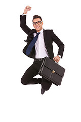 Image showing business man with briefcase jumping