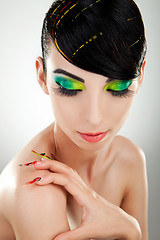 Image showing woman with  bright manicure and makeup