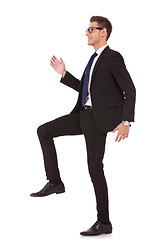 Image showing business man stepping up