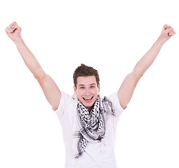 Image showing Casual man looking very happy with his arms up