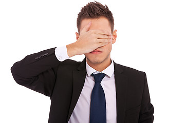 Image showing business man making the see no evil gesture 