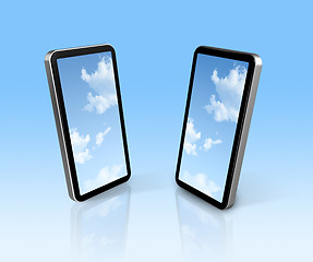 Image showing sky on two mobile phones