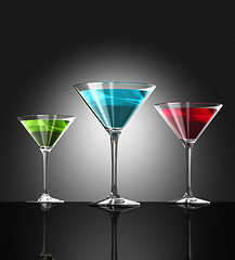 Image showing red, green and blue cocktail glasses