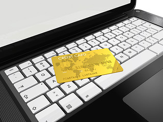 Image showing gold credit card on laptop