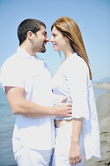 Image showing happy young couple have fun on beach