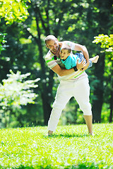 Image showing happy father and son have fun at park