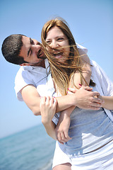 Image showing happy young couple have fun on beach