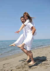 Image showing happy young couple have fun on beach