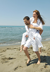 Image showing happy young couple have fun on beach