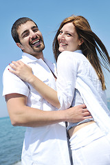 Image showing happy young couple have fun on beach