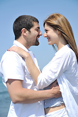 Image showing happy young couple have fun on beach