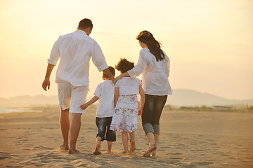 Image showing happy young family have fun on beach at sunset