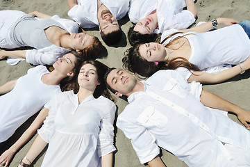 Image showing Group of happy young people in have fun at beach