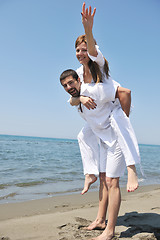 Image showing happy young couple have fun on beach