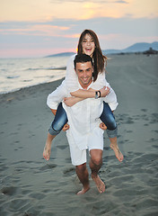 Image showing happy young couple have fun on beach