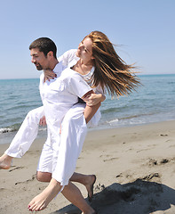 Image showing happy young couple have fun on beach