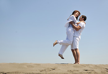 Image showing happy young couple have fun on beach