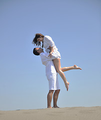 Image showing happy young couple have fun on beach