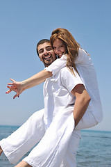 Image showing happy young couple have fun on beach