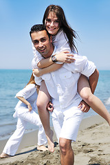 Image showing happy young couple have fun on beach