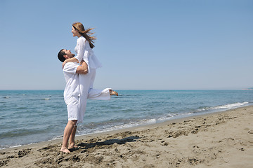 Image showing happy young couple have fun on beach