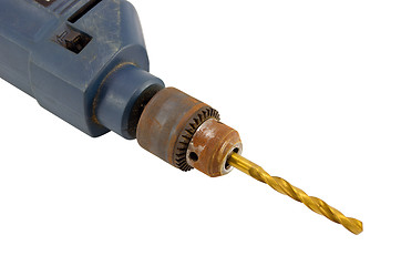 Image showing Rusty old electric drill golden bit closeup 