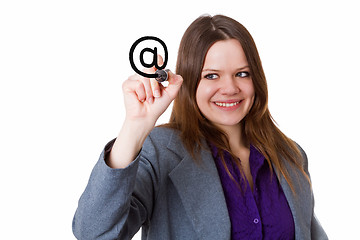 Image showing Young woman writing an at